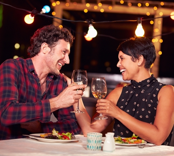 Professional pest control technician on property applying a spray organic mosquito and tick prevention treatment for home, yard, and garden.